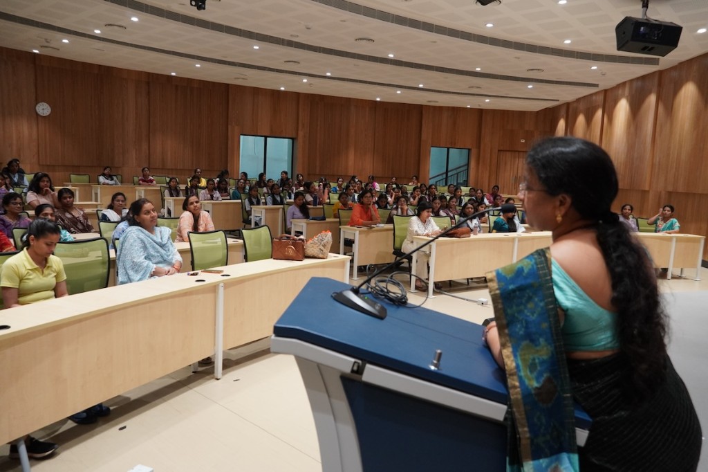 The speaker addressing participants from the podium