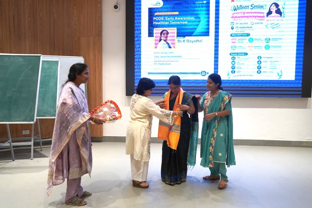 Dr. K. Gayathri Reddy being felicitated with a shawl